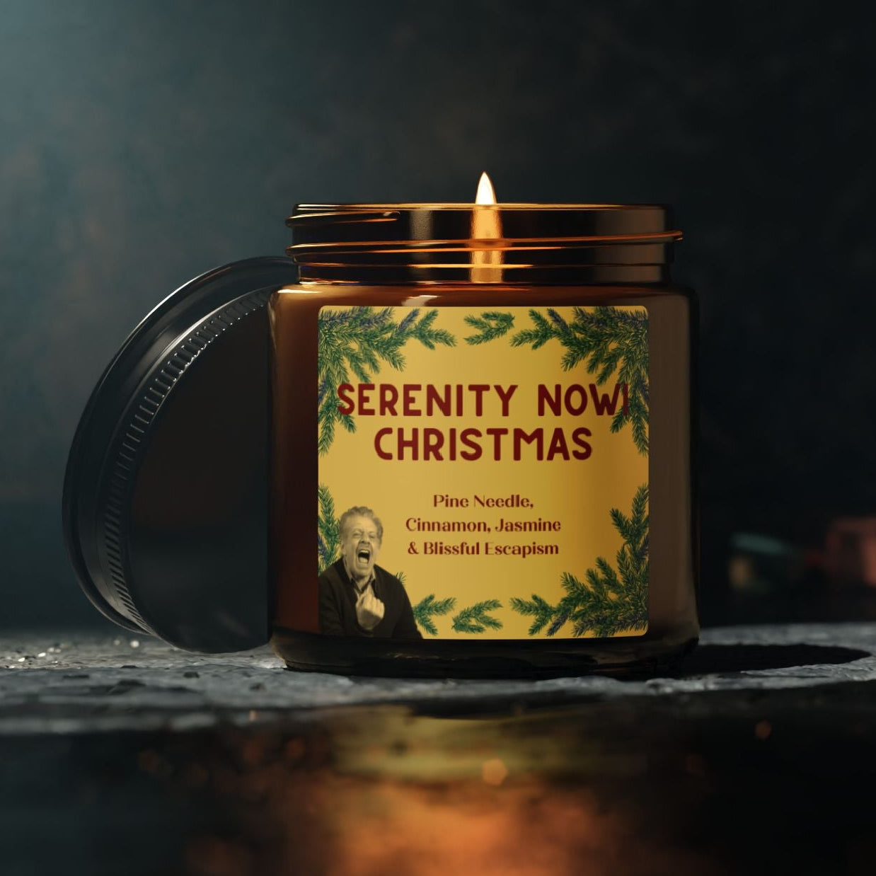 Candle labeled 'Serenity Now Christmas' on a dark background 4oz